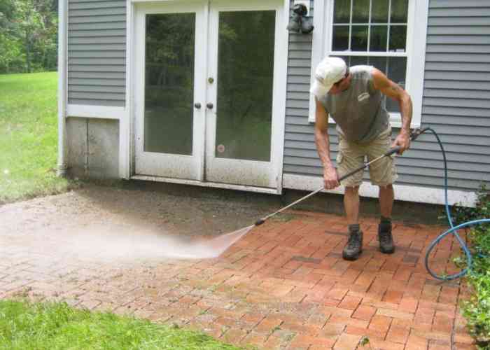 Pressure washing used to clean brick patio.